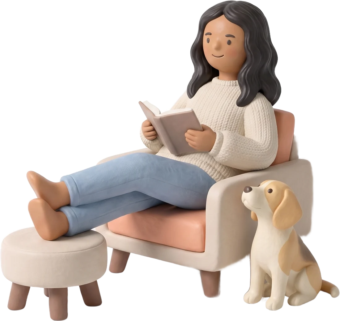 Maya reading in her armchair with her feet up, Coco the beagle beside her